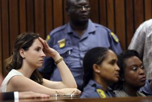 Aimee Pistorius watches as her brother, South African Olympic and Paralympic track star Oscar Pistorius, attends his sentencing at the North Gauteng High Court in Pretoria October 21, 2014