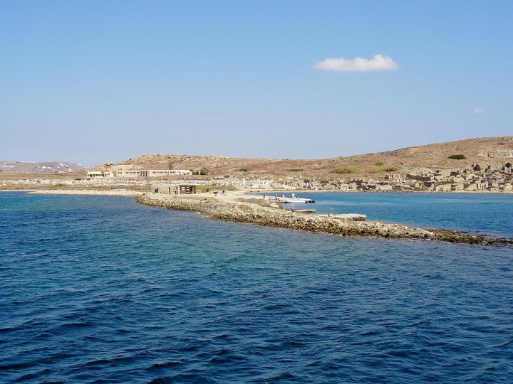 The Greek island of Delos, with numerous ruins still visible. The island is inhabited by only 14 people, according to a 2001 census. The Greek island of Delos, with numerous ruins still visible. The island is inhabited by only 14 people, according to a 2001 census.