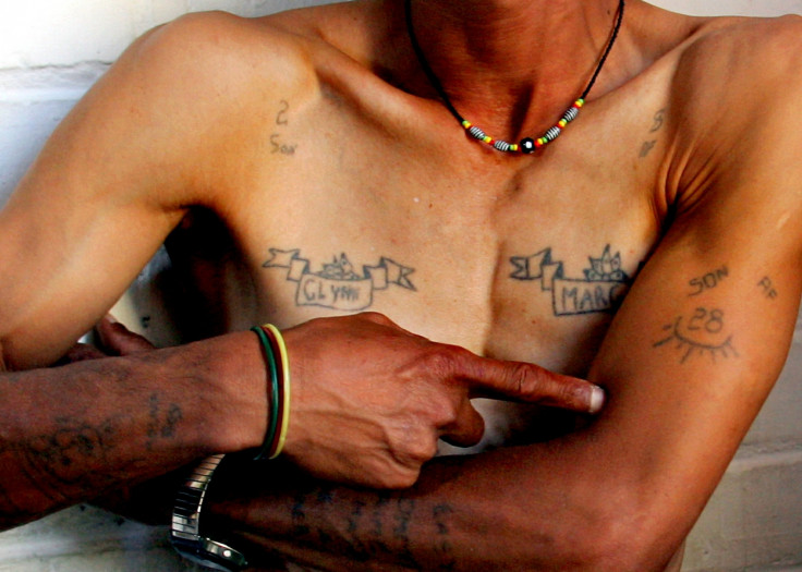 Magadien Wentzel shows his gang tattoos at his home in Mannenberg township near Cape Town