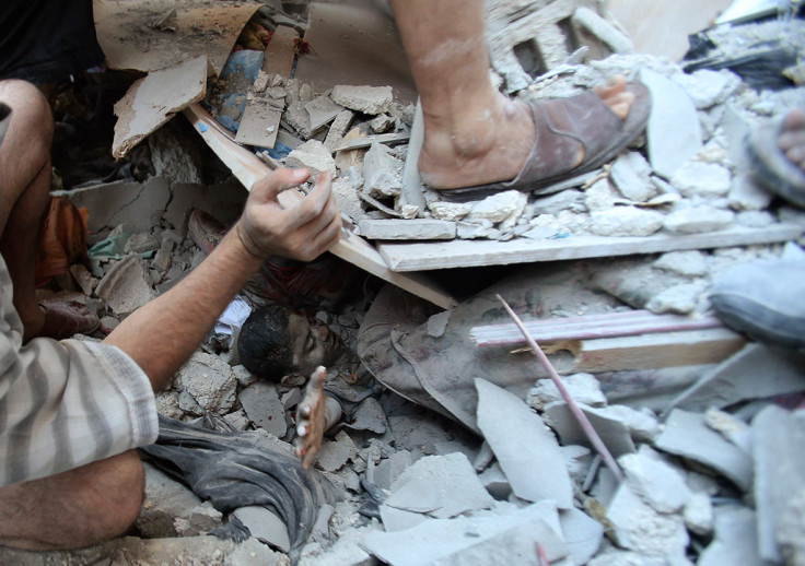 August 3, 2014: Palestinians rescue Mahmoud al-Ghol from under the rubble of a house in Rafah in the southern Gaza Strip