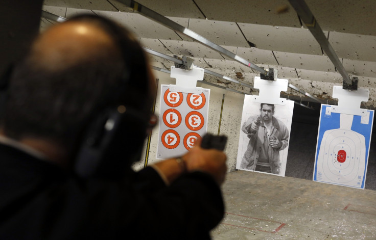 Dennis Krocker fires his handgun at a target at Metro Shooting Supplies' indoor gun range in Bridgeton, Missouri