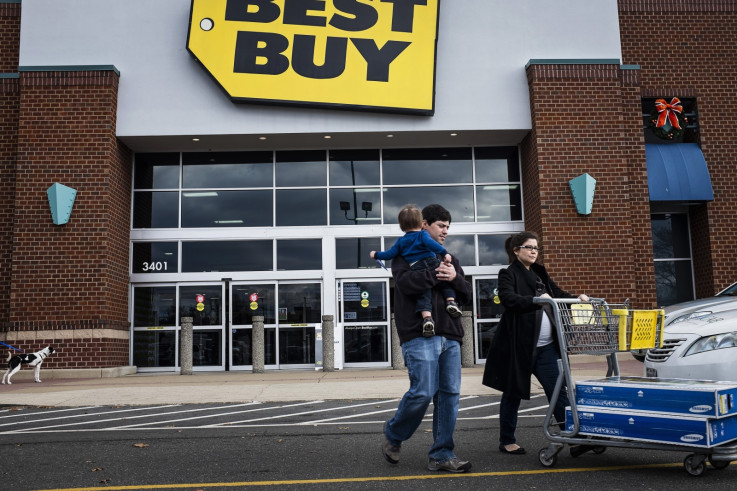 Black Friday shoppers leave a Best Buy store in Alexandria, Virginia
