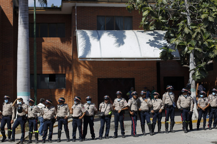 Venezuelan riot police stand guard in front of the morgue in Barquisimeto