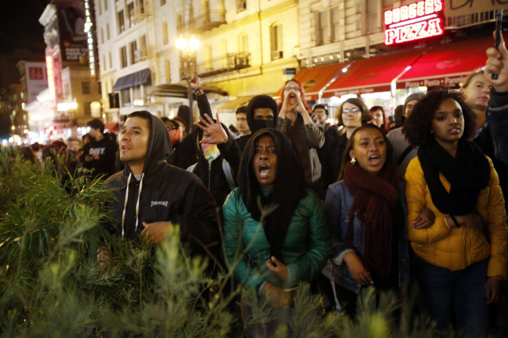 Demonstrators chant against the police during a demonstration against the grand jury decision in the Ferguson, Missouri shooting of Michael Brown