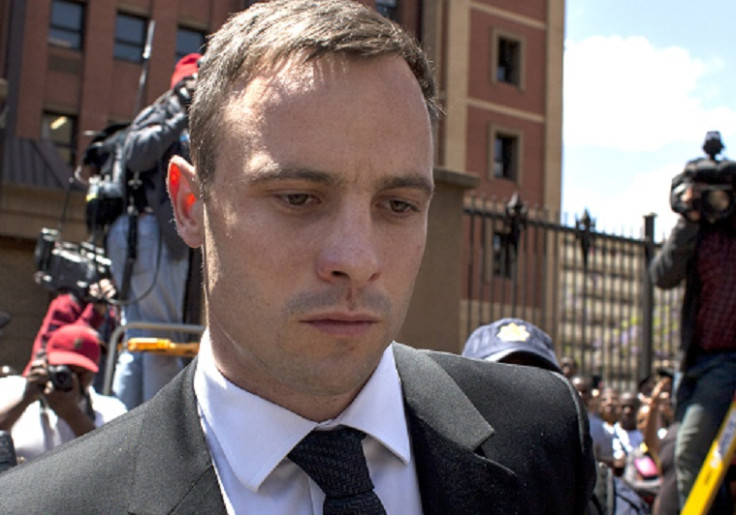 Oscar Pistorius is growng a beard and dresses in a regular orange prison uniform, revealed brother Carl