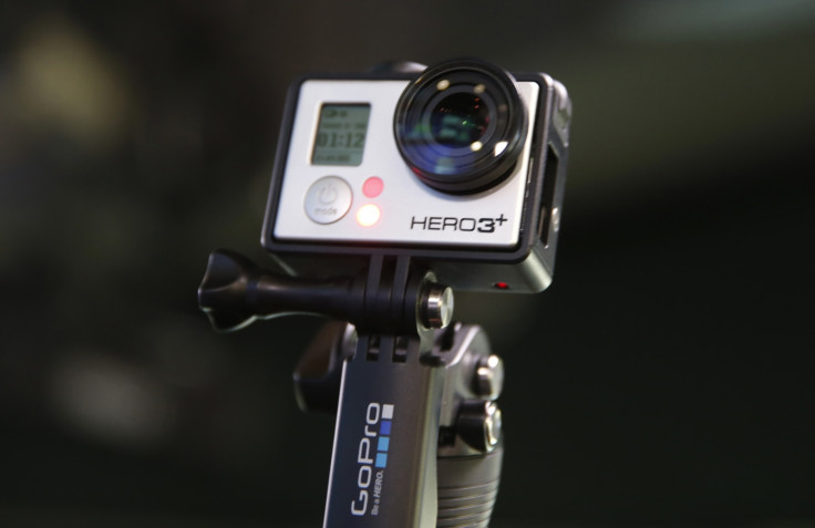 A GoPro Hero 3  camera connected to an extendible tripod
