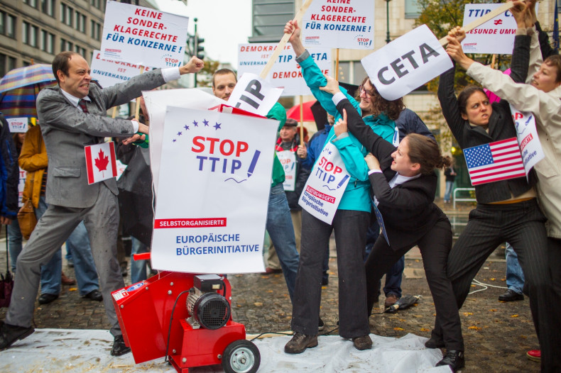 Activists protest against planned trade pacts; TTIP (Transatlantic Trade and Investment Partnership) and CETA (Comprehensive Economic and Trade Agreement) with the U.S. and Canada, in Berlin October 11, 2014