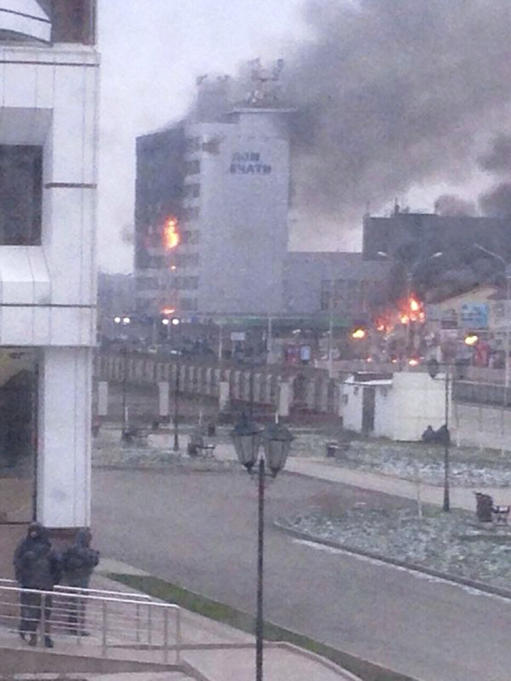 A local media building known as the Press House burns as militants attack in the Chechen capital Grozny, December 4, 2014.