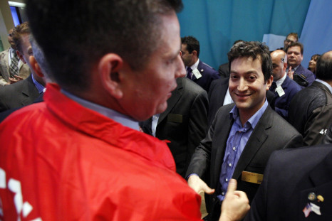 Shutterstock founder and CEO Jon Oringer (R) celebrates his company's first trades following it's IPO on the floor of the New York Stock Exchange, October 11, 2012.