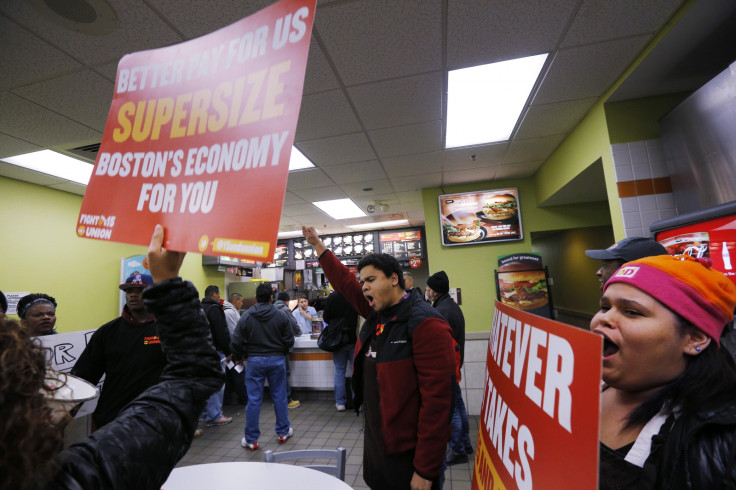 Scores of fast food workers and their supporters calling for a $15 minimum wage fill a McDonalds restaurant in Chelsea, Massachusetts December 4, 2014.