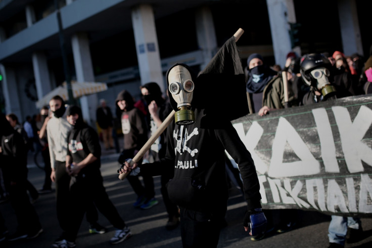 Protesters gather in Athens yesterday. (ANGELOS TZORTZINIS/AFP/Getty)