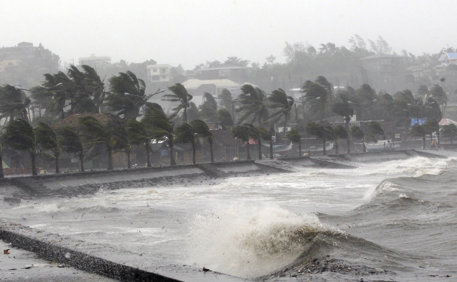 Typhoon Hagupit: Weakened tropical storm to pass Philippines capital ...