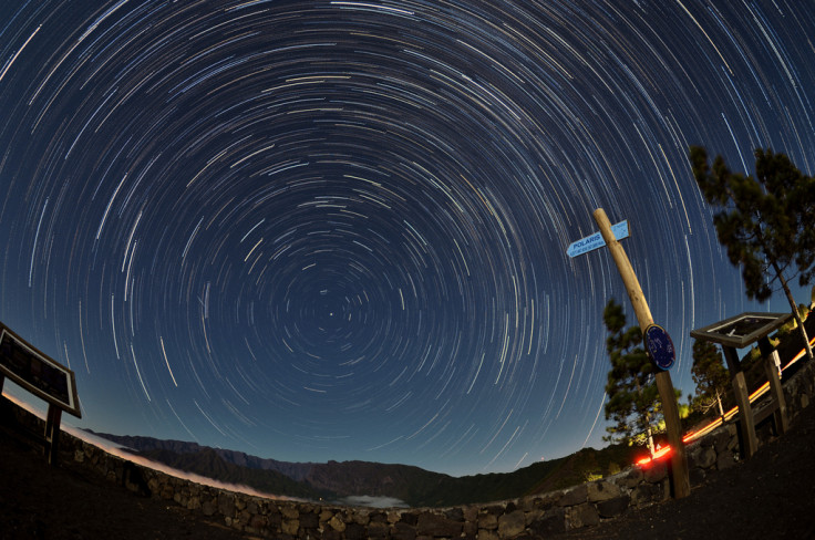 A photograph of star trails comprised of long exposure images edited together using the Star Trails freeware