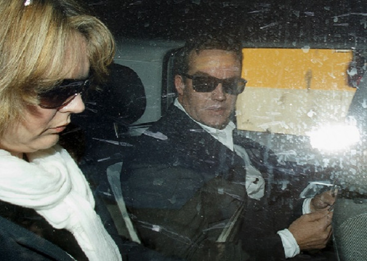 Robert Murat (right) and wife Michaela Walczuch leave Faro Police Station after police interview