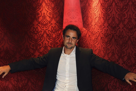 Herve Falciani, an ex-HSBC employee wanted in Switzerland on charges of stealing data on bank accounts, poses in a restaurant prior to an interview with Reuters in Paris July 17, 2013