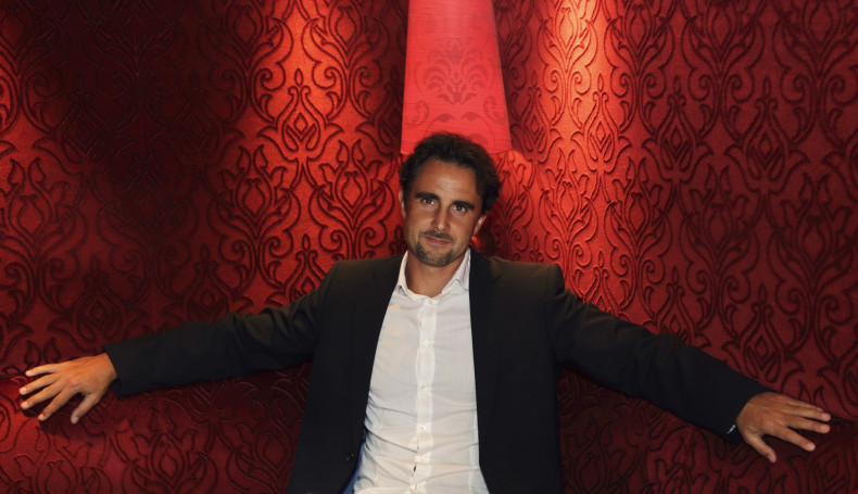 Herve Falciani, an ex-HSBC employee wanted in Switzerland on charges of stealing data on bank accounts, poses in a restaurant prior to an interview with Reuters in Paris July 17, 2013