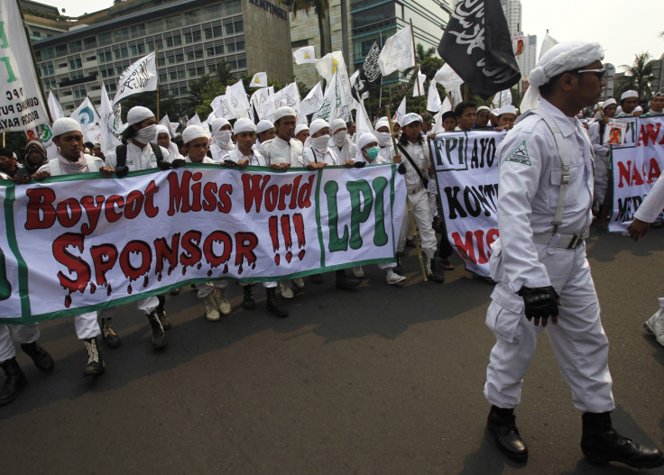 Indonesian hardliner Muslim protesters shout slogans during a protest against the Miss World pageant in Jakarta in 2013