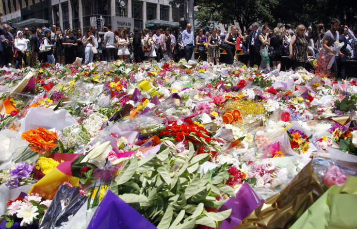 Sydney cafe siege tributes and investigation