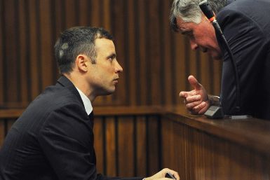 Brian Webber and Oscar Pistorius talk during his trial