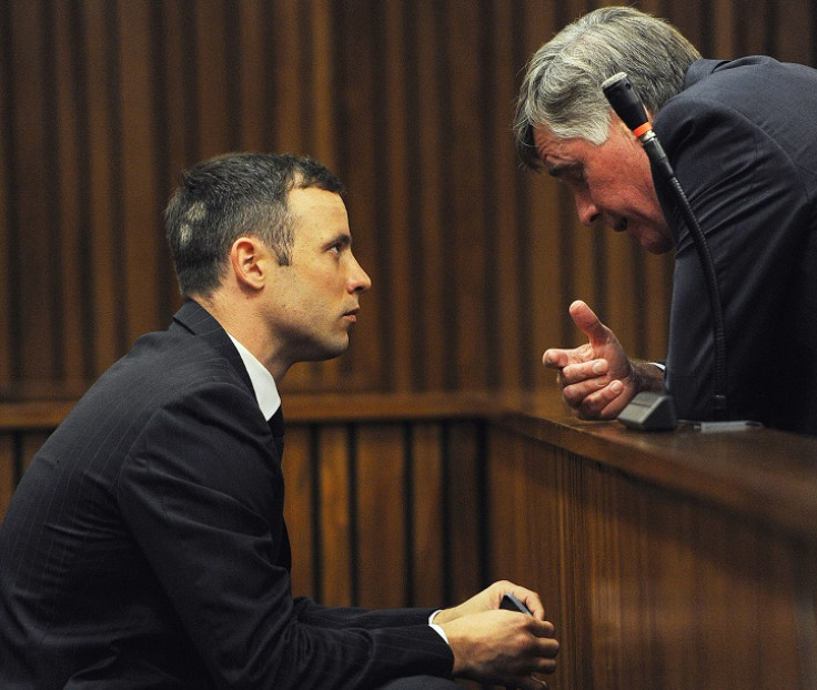 Brian Webber and Oscar Pistorius talk during his trial