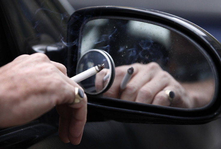Man smoking in his car