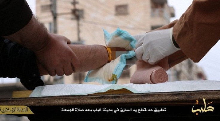 The man's bloody stump is cleaned up after his hand is cut off