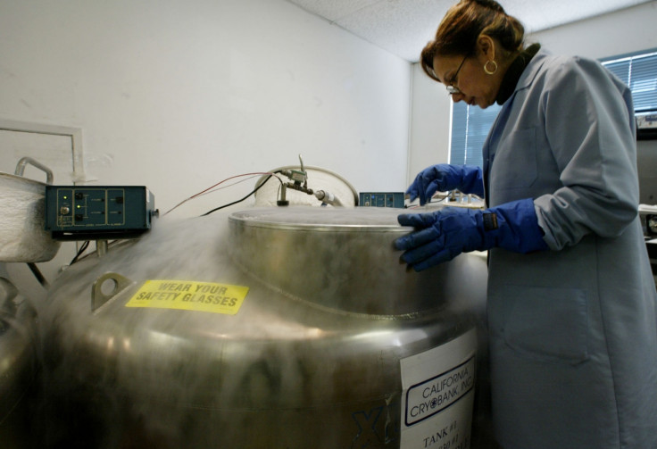 A scientist in California stands over a cryogenic tank. (Reuters)