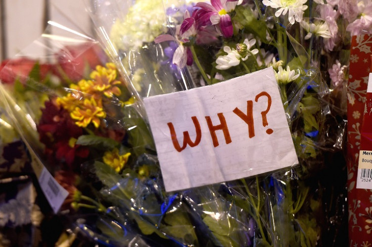 Floral tributes are placed near to the scene of yesterday's bin lorry crash