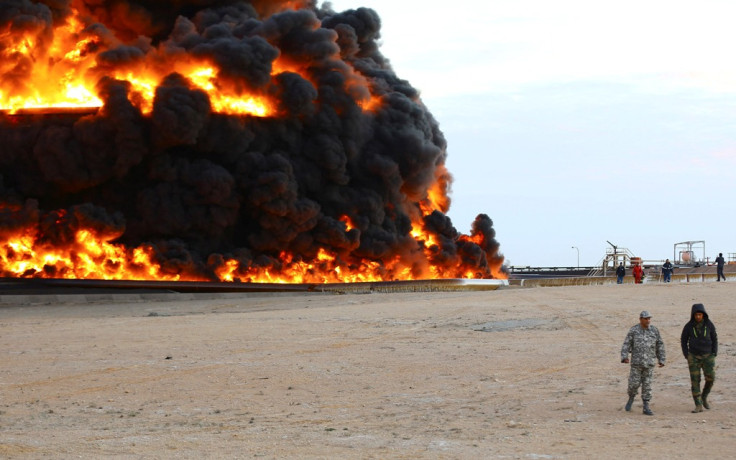 An oil tank burns in Libya's Es Sider port on 26 December