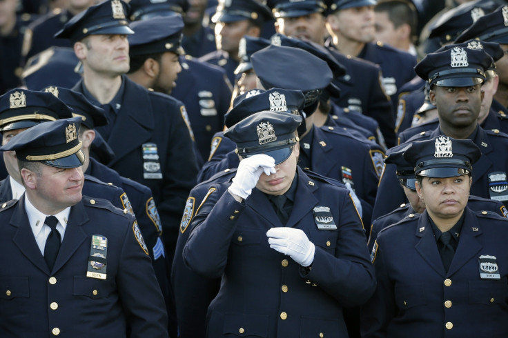 Policemen line-up near the Christ Tabernacle Church