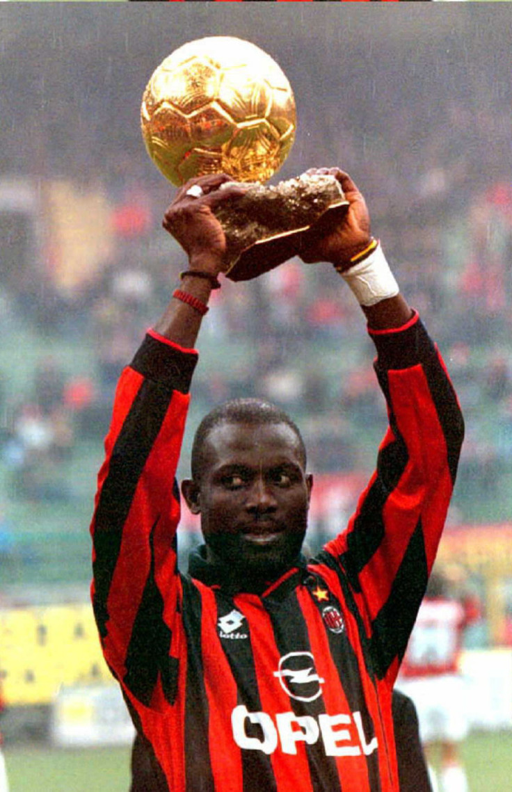 George Weah holds aloft the Eurpean player of the Yera award in 1996. (Getty)
