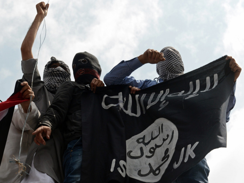 Protesters in Kashmir hold aloft the Isis flag, in recent protests against Israel's bombardment of Gaza. (Getty)