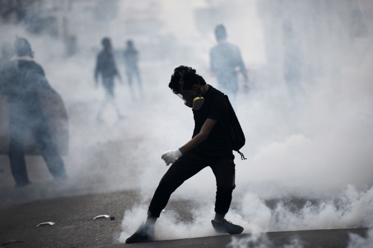 A Bahraini protester kicks back a tear gas canister during clashes with riot police following a protest against the arrest of the head of the banned Shiite opposition movement A Bahraini protester kicks back a tear gas canister during clashes with riot police following a protest against the arrest of the head of the banned Shiite opposition movement