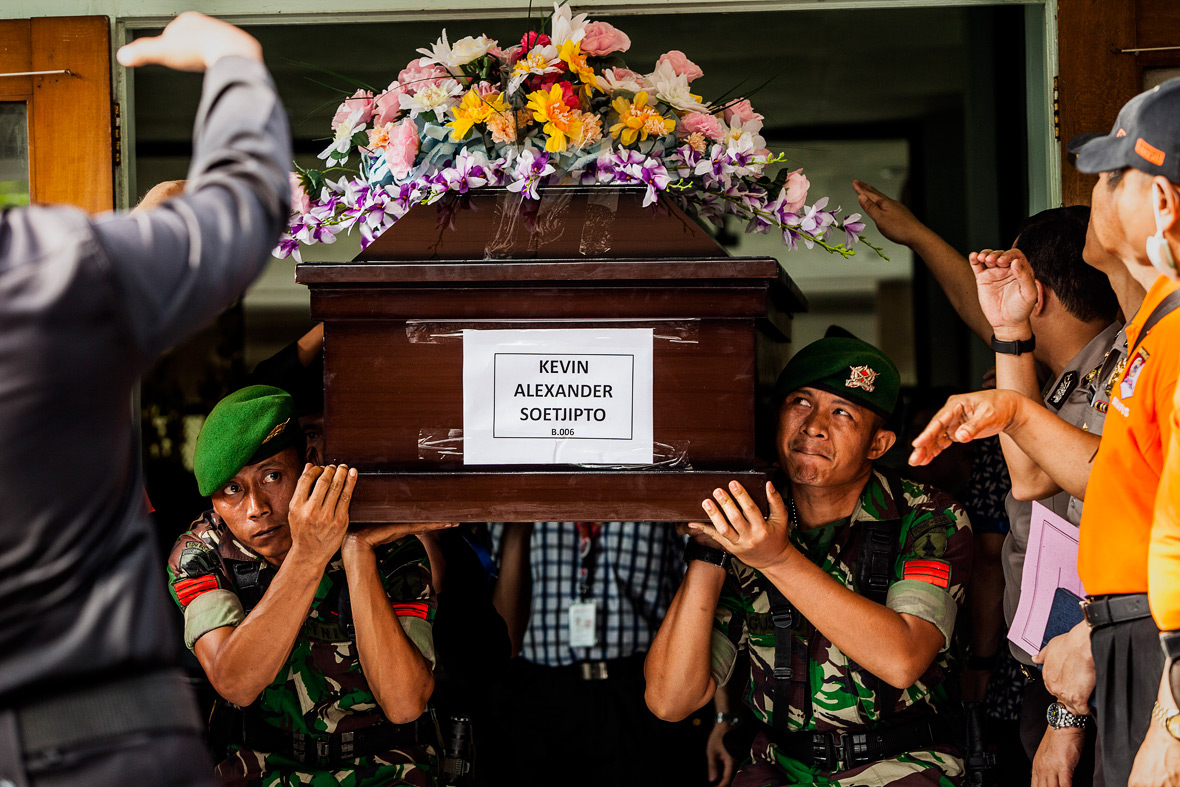 Airasia Flight Qz8510 Photos Recovered Bodies Are Identified And Returned To Families For Burial 