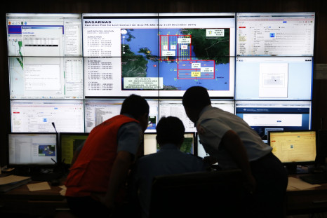 Authorities monitor progress in the search for AirAsia Flight QZ8501 in the Mission Control Center inside the National Search and Rescue Agency in Jakarta