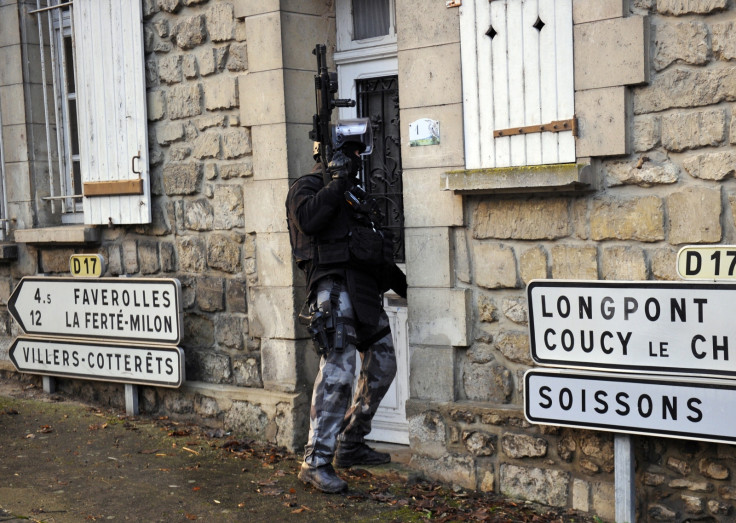 Members of the French police special force GIPN opens a door in Corcy, northern France
