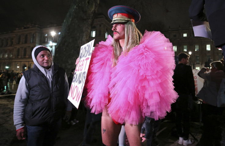 A gay rights protester rallies against Russia's anti-gay stance outside Downing Street, central London