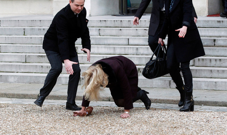 Danish Prime Minister Helle Thorning-Schmidt (C) took an unfortunate tumble as she tripped up on the stairs at the Elysee Palace after attending a Unity rally.