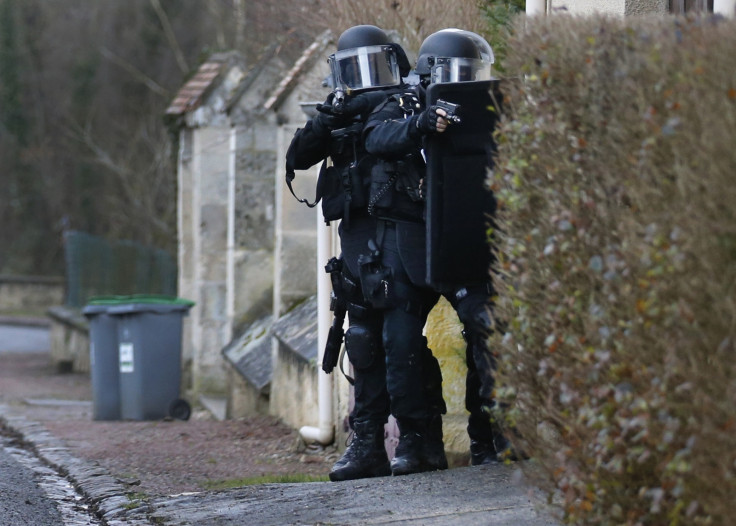 Members of the French GIPN intervention police forces search a neighbourhood in Longpont, northeast of Paris