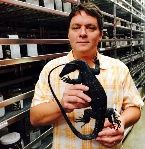 Rafe Brown holds the Holotype