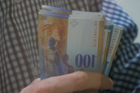 People rush to cash in as Swiss franc soars