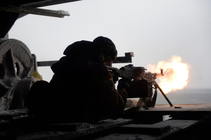 A Ukrainian volunteer fighter fires on a rebel position in Donetsk (Getty)