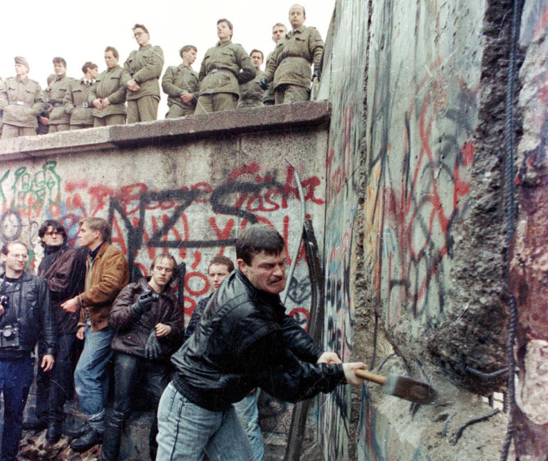 Activists destroy the Berlin Wall, dividing East and West Germany in 1989. (Reuters)