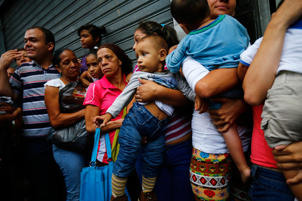 The latest job opportunity in crisis-hit Venezuela: Standing in ...