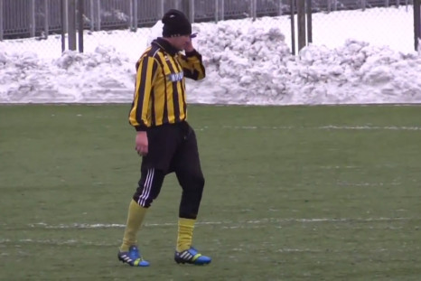 Ukrainian footballer Oleh Makarov answers mobile phone during match