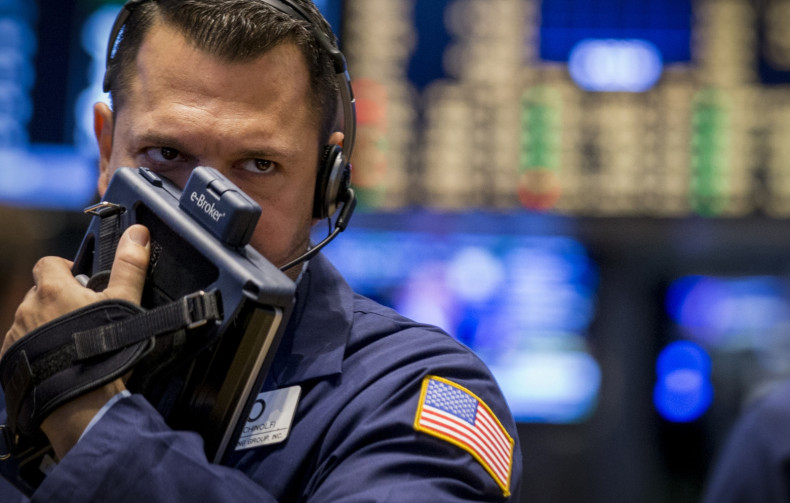 A trader works on the floor of the New York Stock Exchange August 15, 2014.