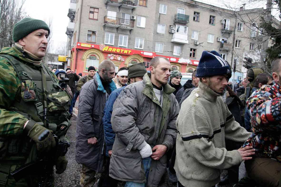 Ukrainian servicemen forced to kneel while women punch them after bus ...