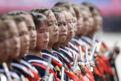 School children in North Korea parade with guns in Kim Il-sung Square, Pyongyang