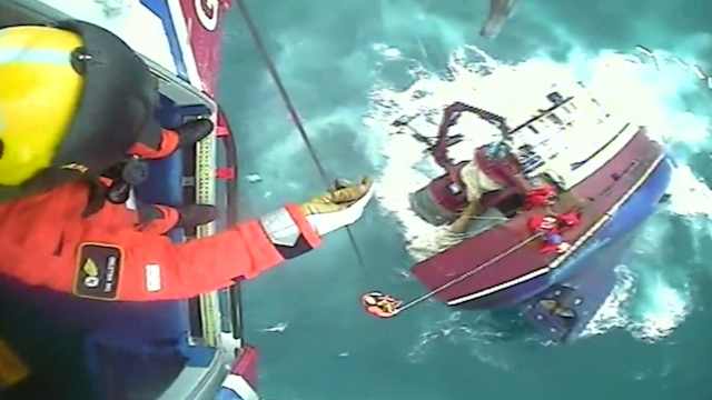 UK coast guard rescues five people from sinking boat in 