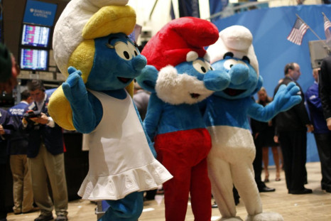Costumed &quot;Smurfs&quot; characters wave on the main trading floor of the New York Stock Exchange.